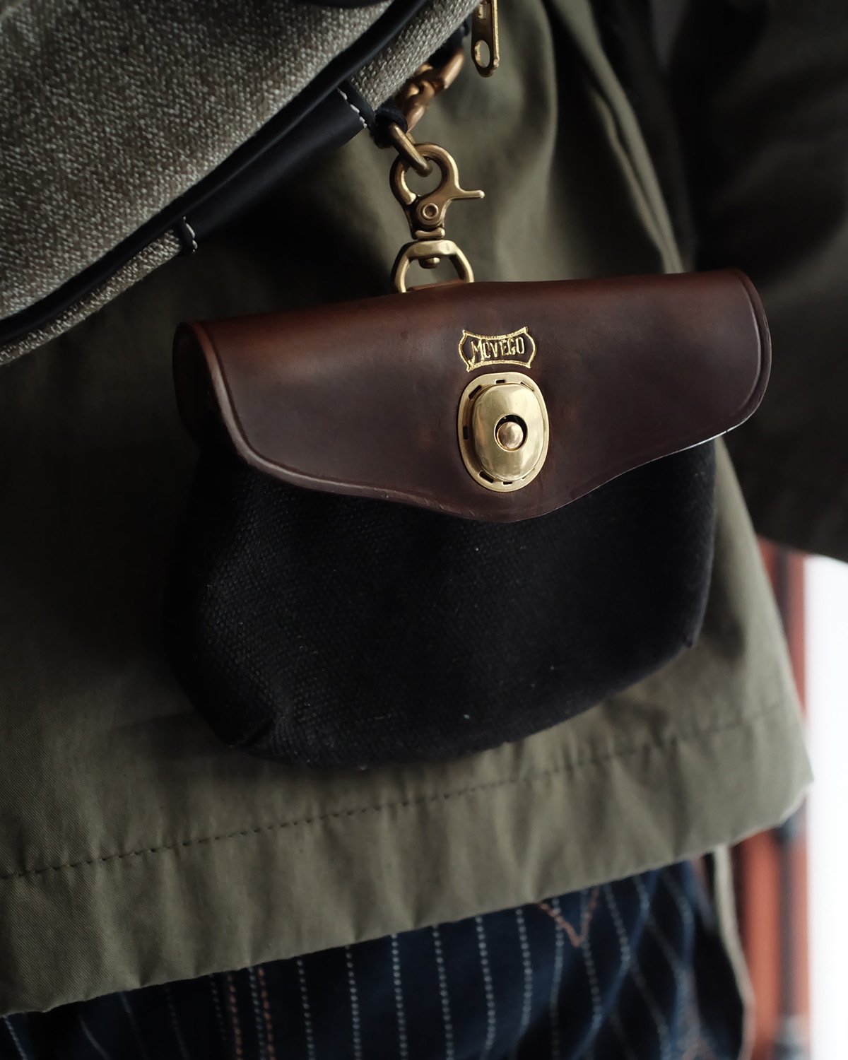 A canvas and leather messenger bag from the Movego collection